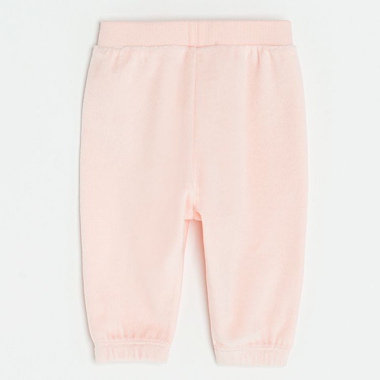 Pink velvet jogging pants with hearts on the ankles