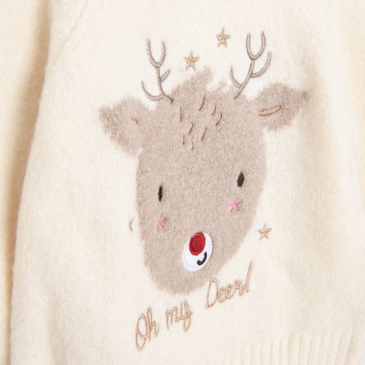 White sweater with raindeer print and ruffle at the bottom