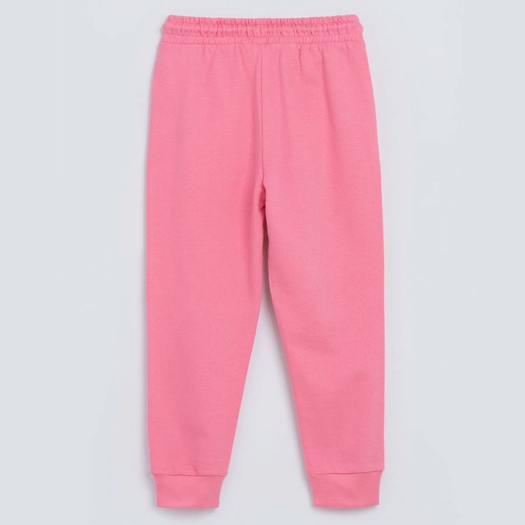 Pink jogging pants with unicorn print on the knees