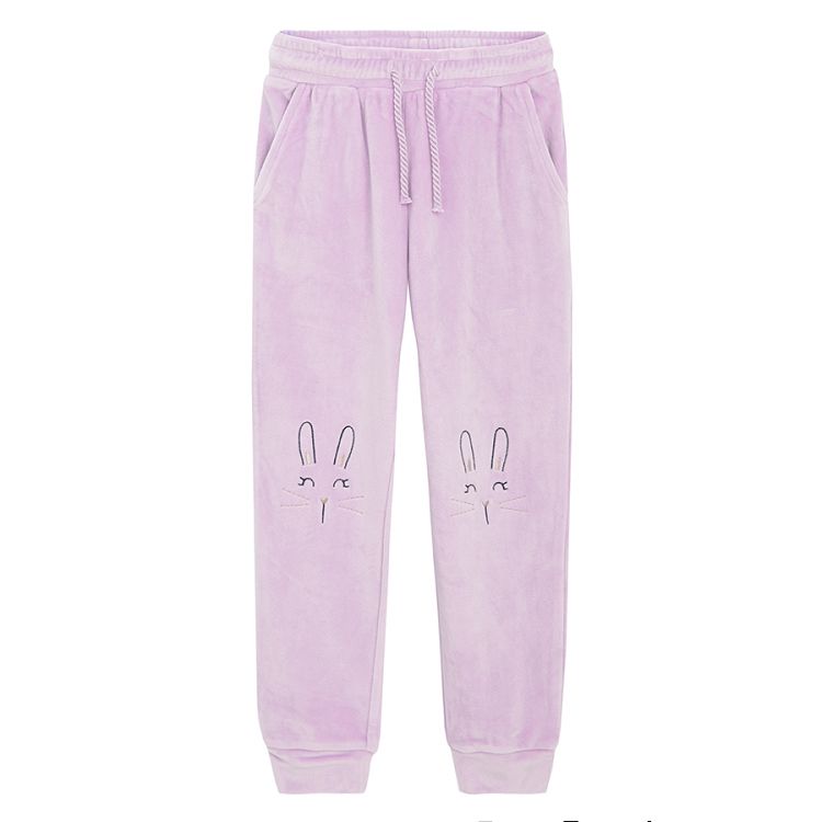 Purple jogging pants with bunny faces on the knees