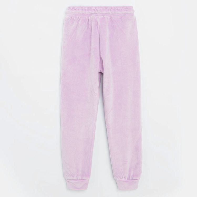 Purple jogging pants with bunny faces on the knees