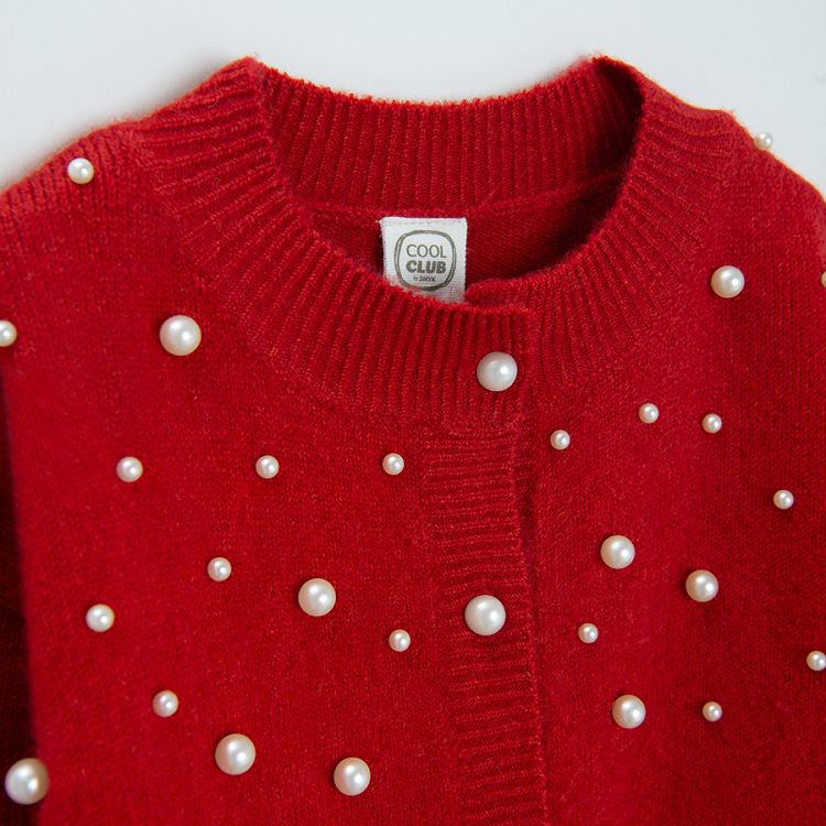 Red cardigan with white pearls