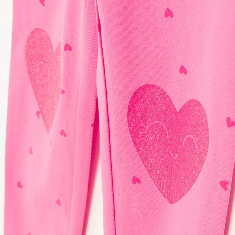 Pink leggings with red hearts print