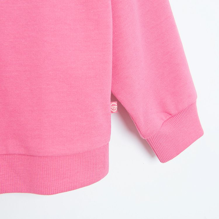 Pink sweatshirt with floral embroidery around the neckline