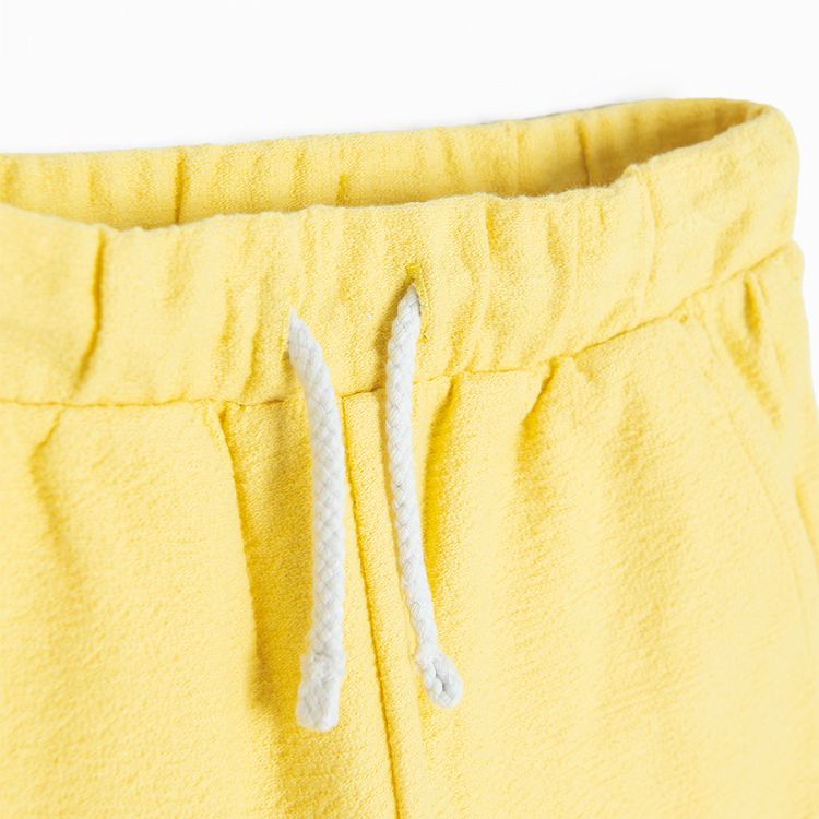 Yellow shorts with cord on the waist