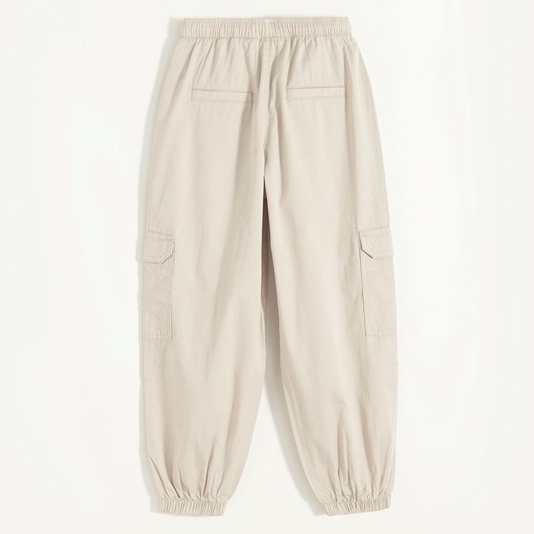 Beige wide pants with side pockets