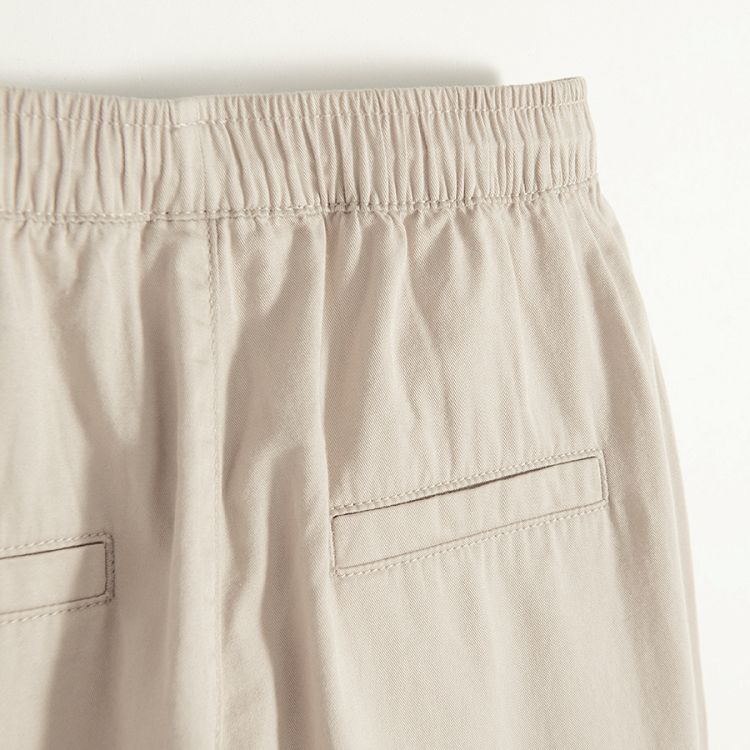 Beige wide pants with side pockets