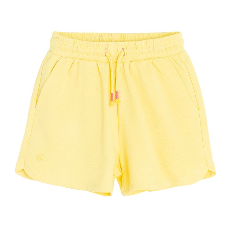 Yellow sports shorts with cord on the waist