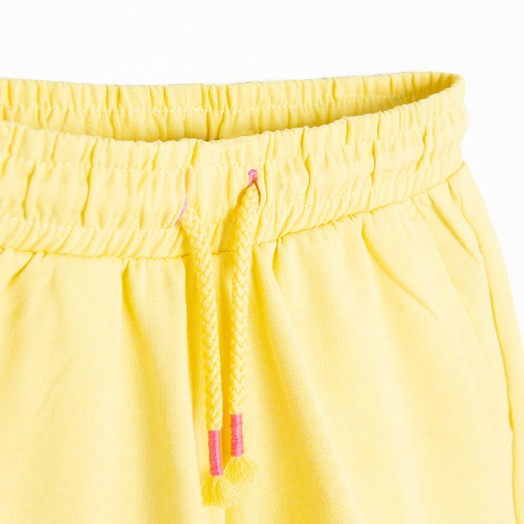 Yellow sports shorts with cord on the waist