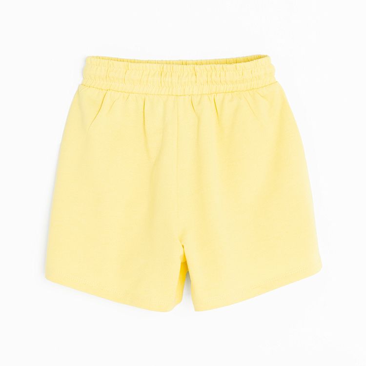 Yellow sports shorts with cord on the waist