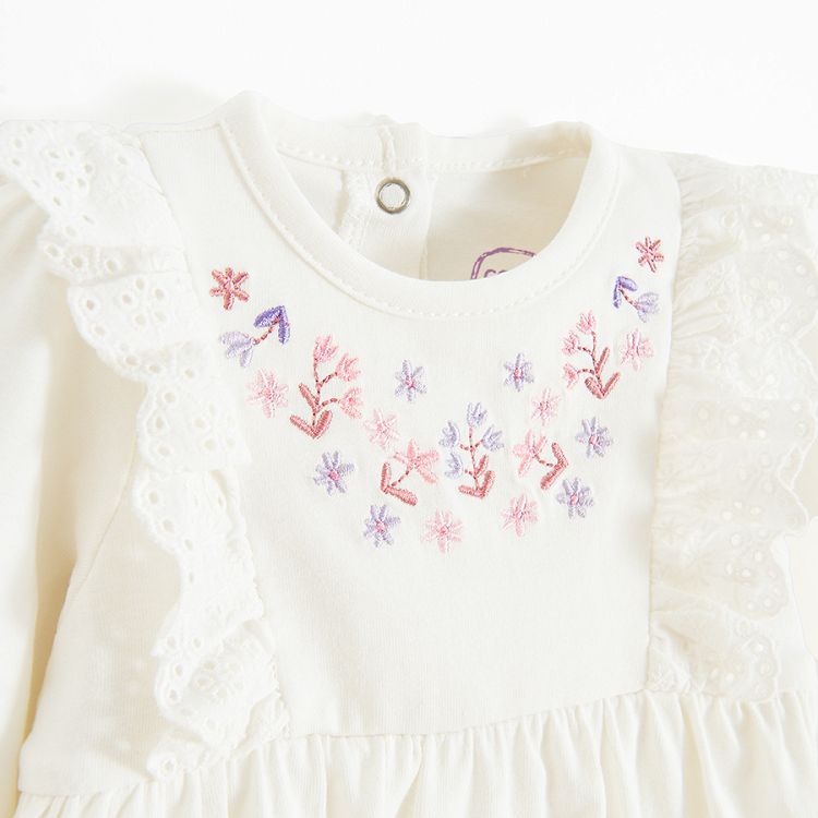 Ecru bodysuit/dress with embroidery around the neck line