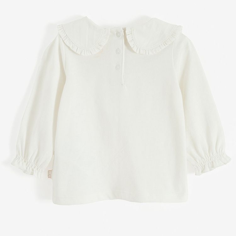 White long sleeve blouse with round collar and elastic around wrists