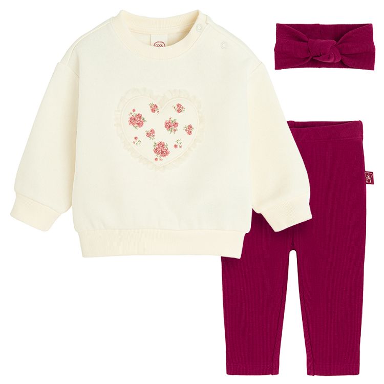 White sweatshirt with a heart print andburgundy leggings and headband