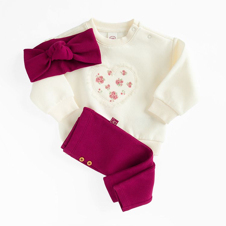 White sweatshirt with a heart print andburgundy leggings and headband