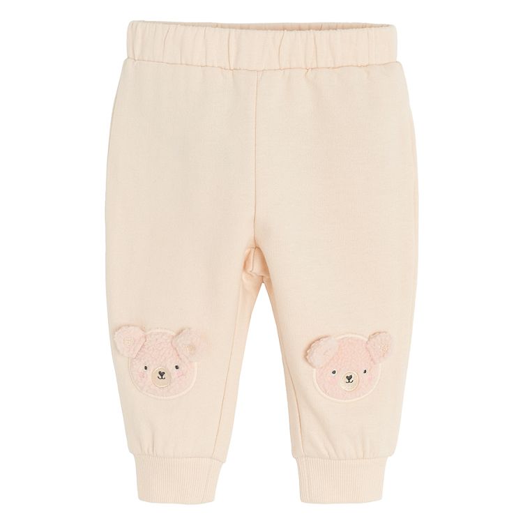 Ecru jogging pants with bear print