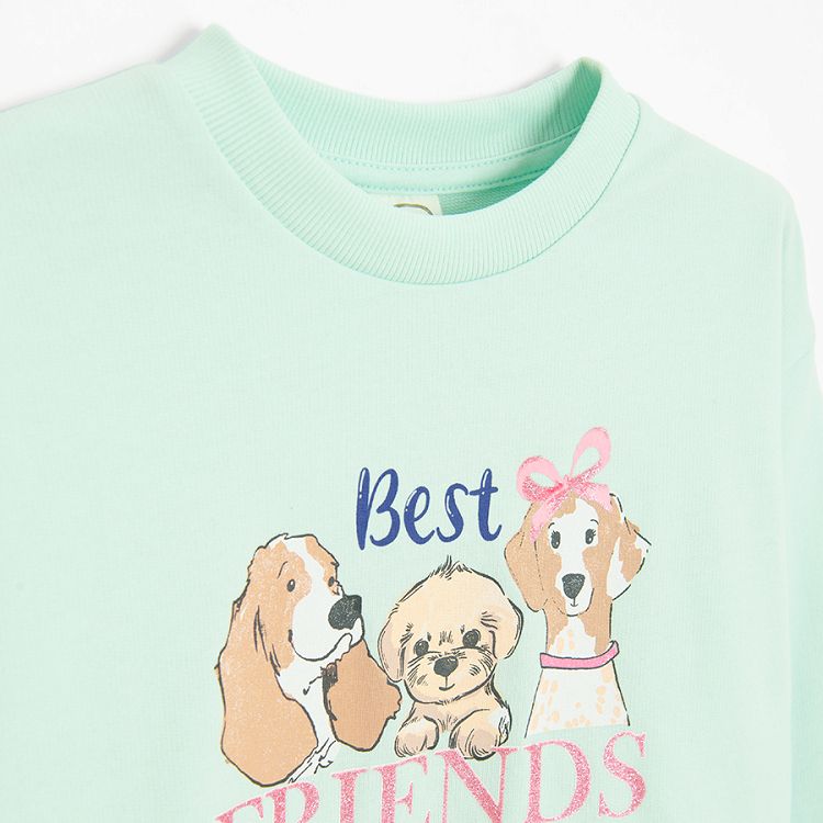 Light green sweatshirt with puppies print