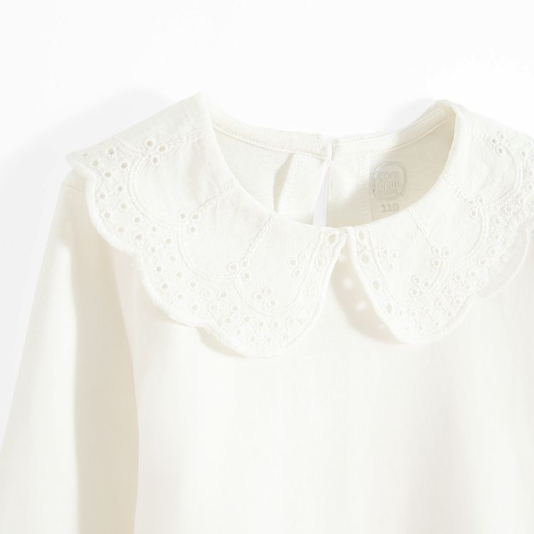 White long sleeve blouse with ruffle on the neckline