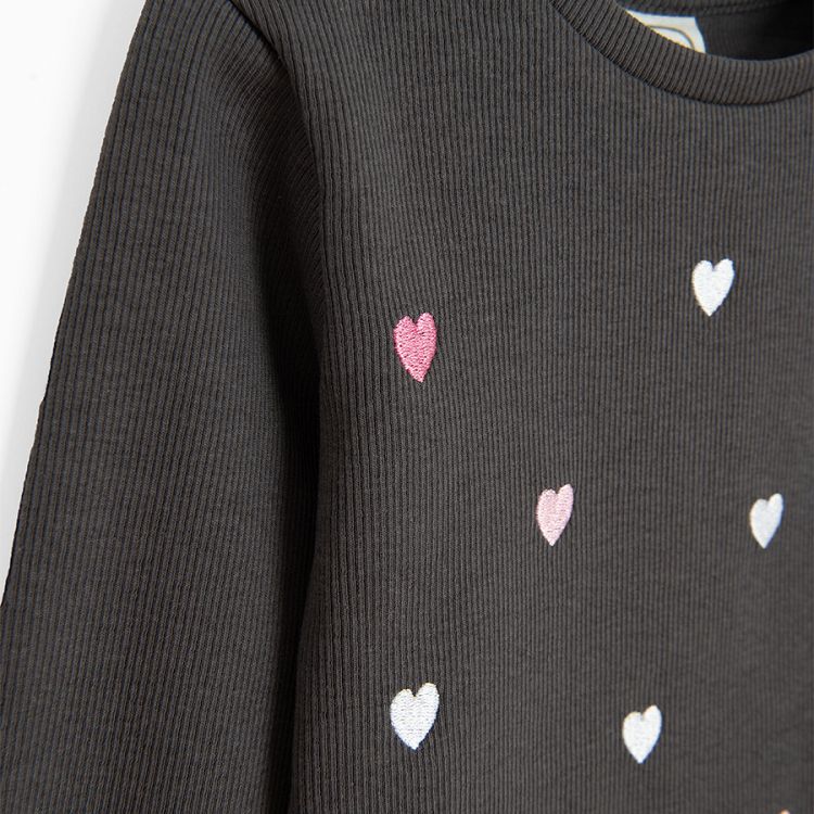 Black long sleeve blouse with hearts print