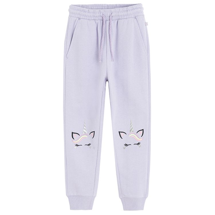 Purple jogging pants with unicorn print on the knees