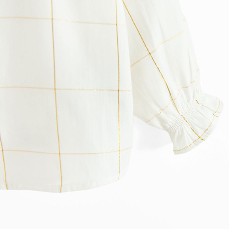 White long sleeve shirt with square ruffle and ruffles on the wrists