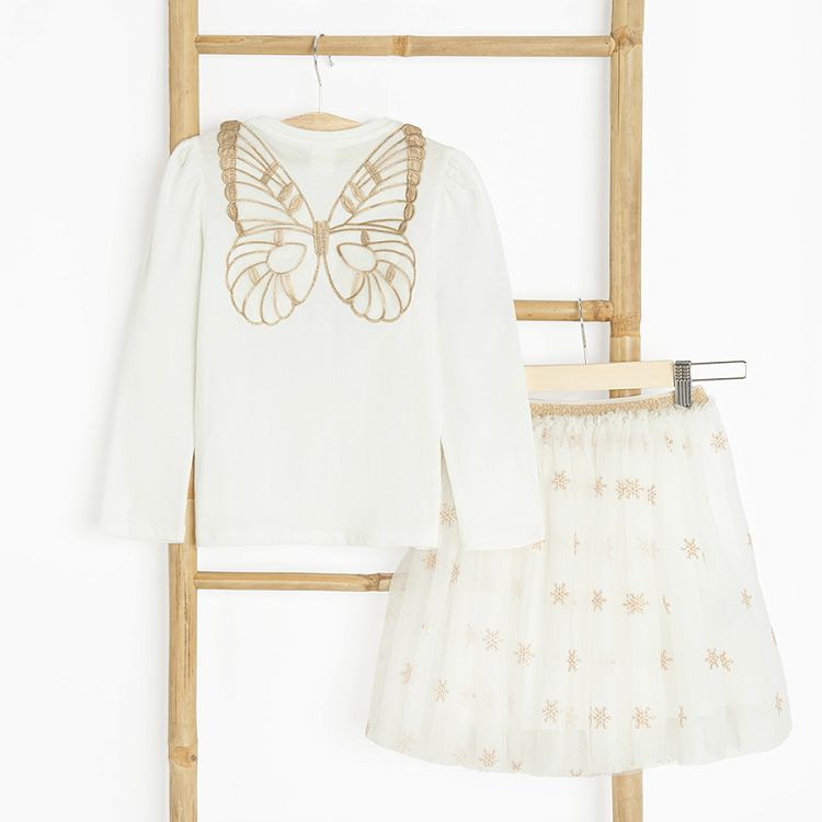 White long sleeve blouse with gold stars with fairy's wings on the back and skirt with stars set