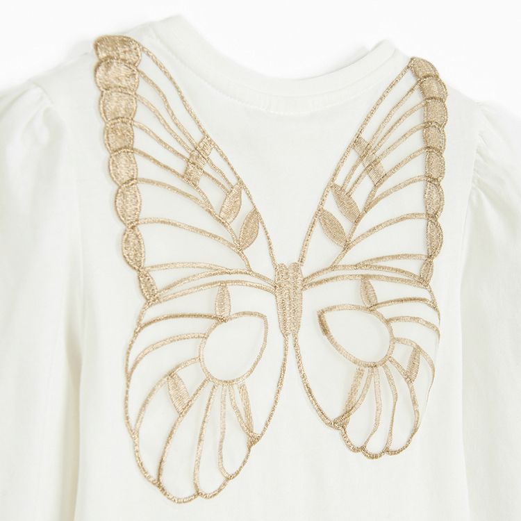 White long sleeve blouse with gold stars with fairy's wings on the back and skirt with stars set