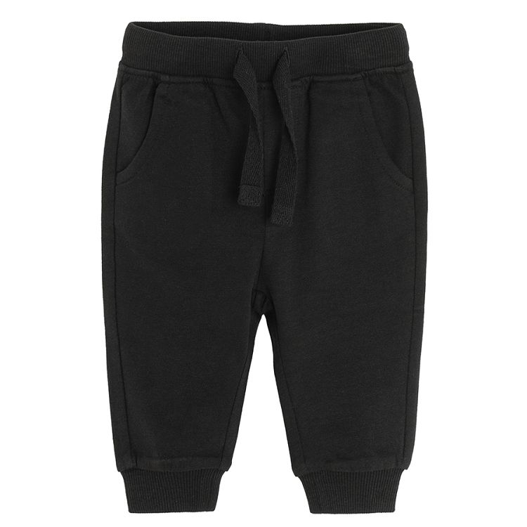 Black sweatpants with elastic on the ankles and cord