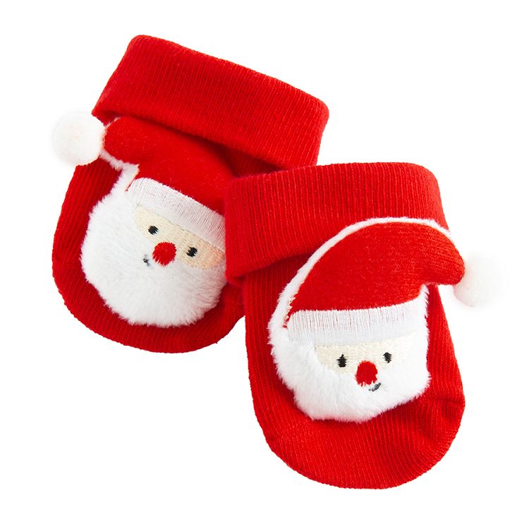 Red socks in box with Santa Claus pattern