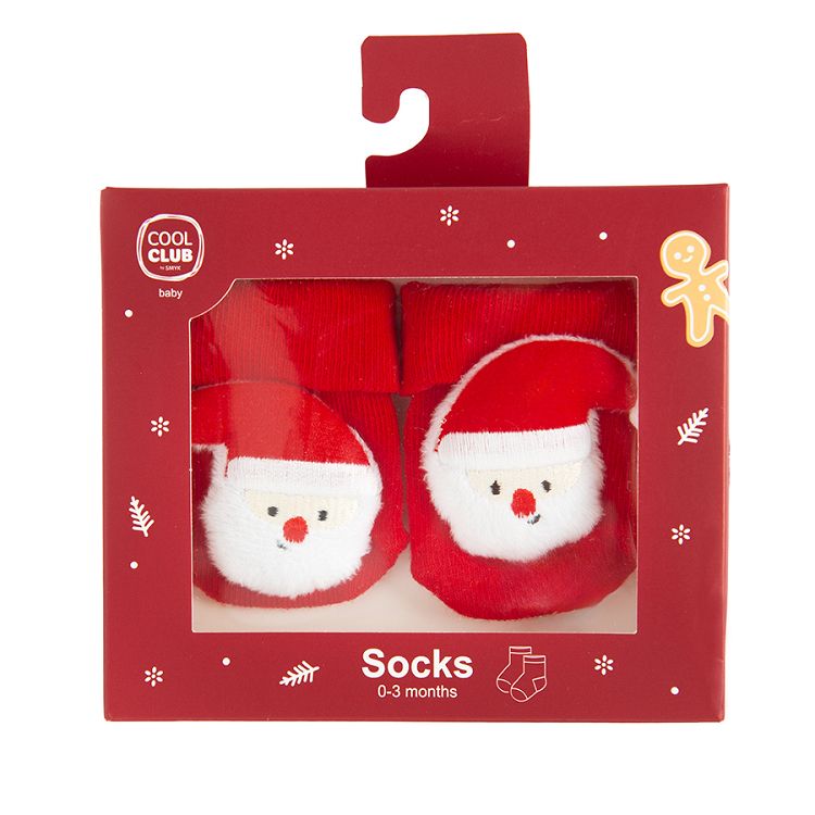 Red socks in box with Santa Claus pattern