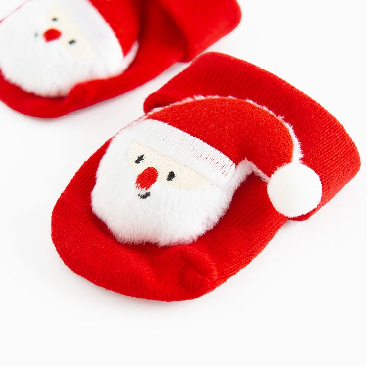 Red socks in box with Santa Claus pattern