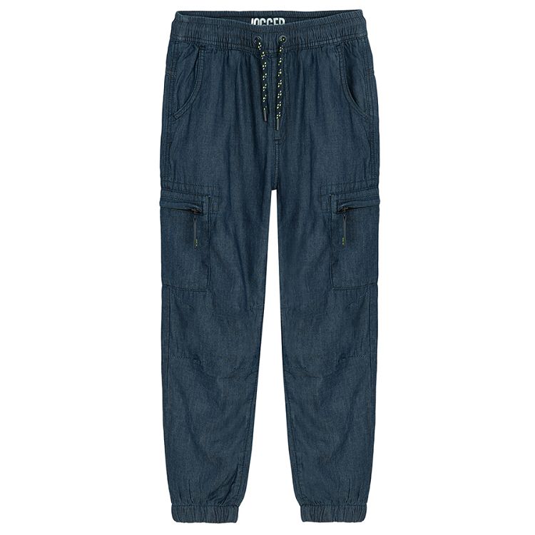 Blue denim pants with external side pockets