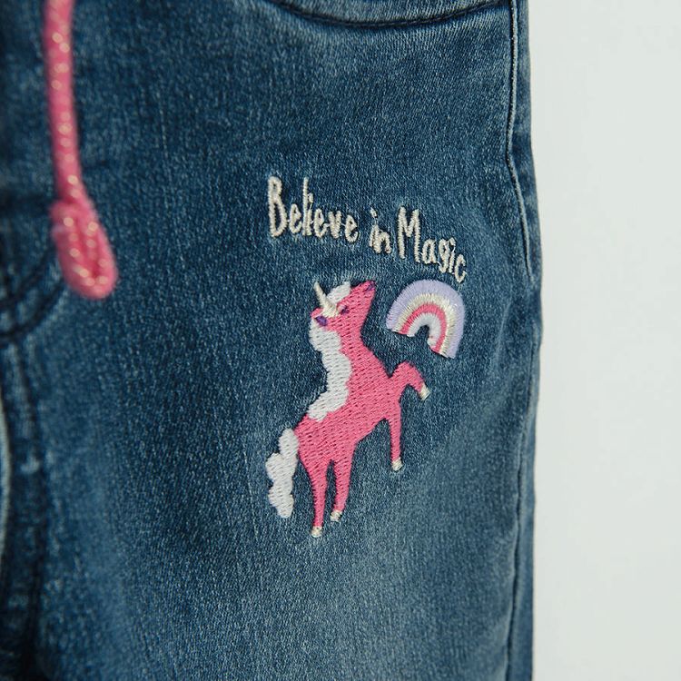 Denim pants with unicorn print and pink lining