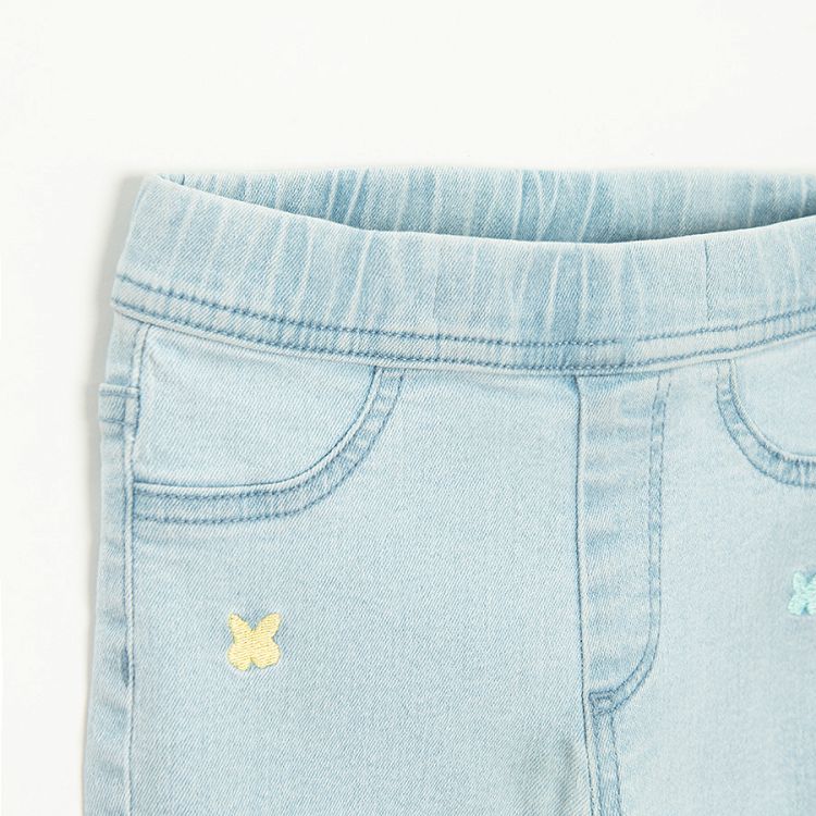 Light denim leggings with small butterflies print