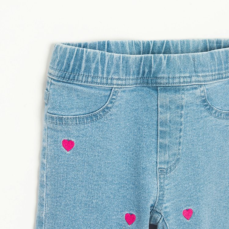 Light blue denim leggings with red strawberries