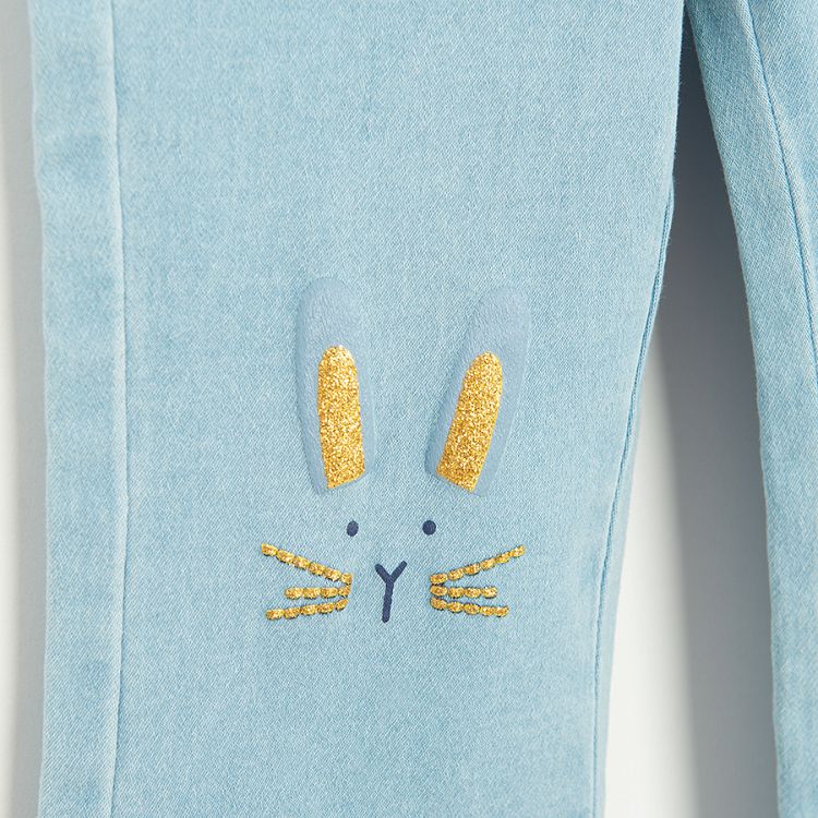 Light blue wide leg denim pants with bunny embroidery on knees