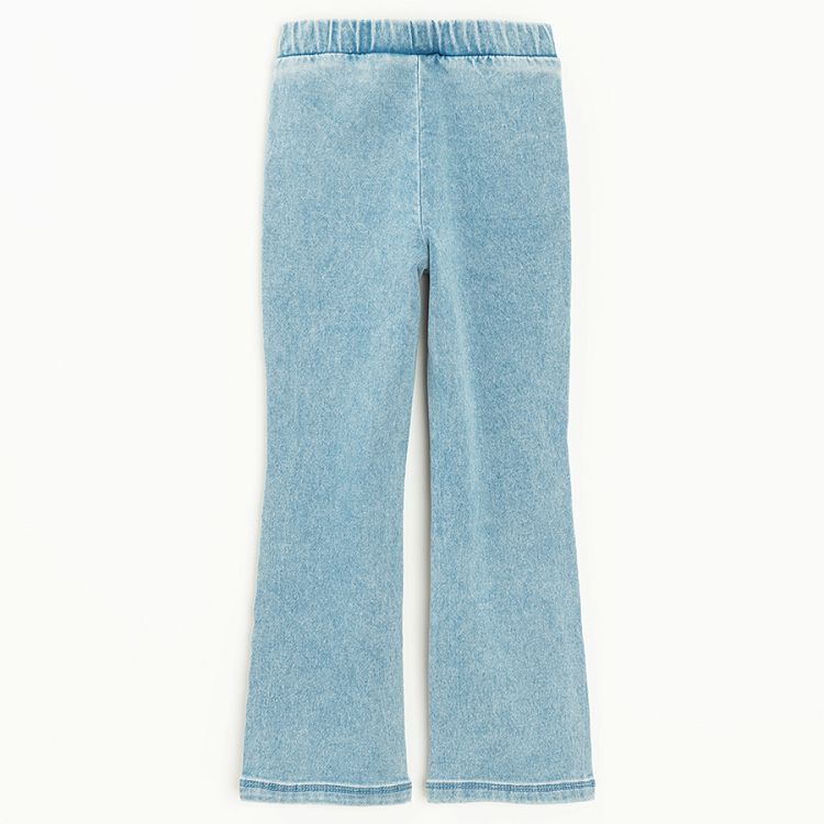 Light blue denim pants with kitten pattern on the knees