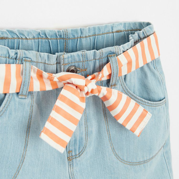 Blue denim shorts with striped white and pink belt