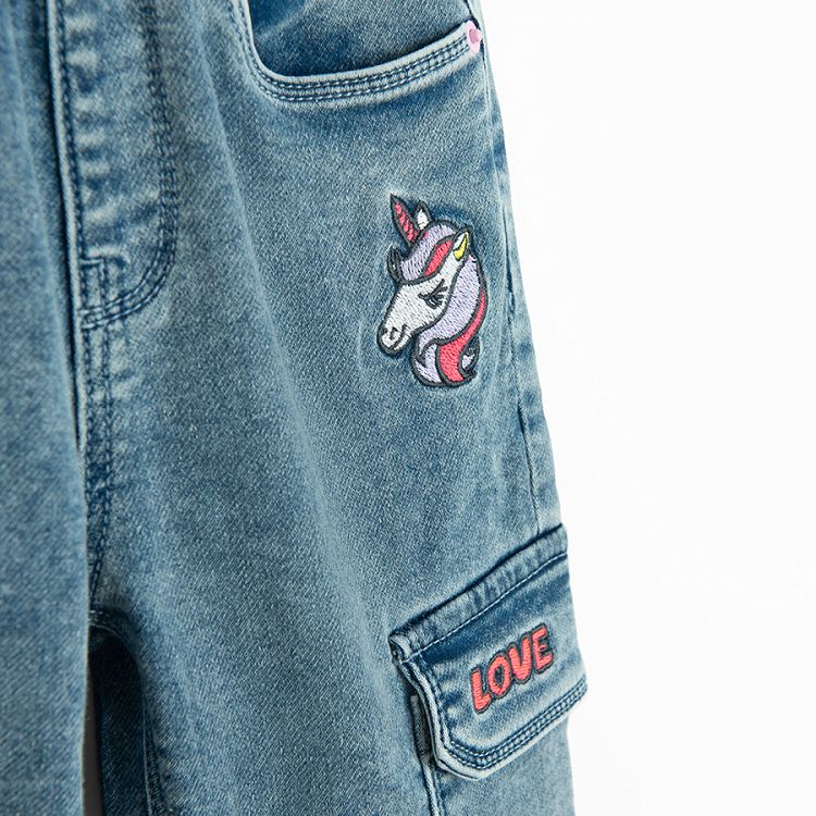 Denim pants with side pockets and unicorn print on front pocket