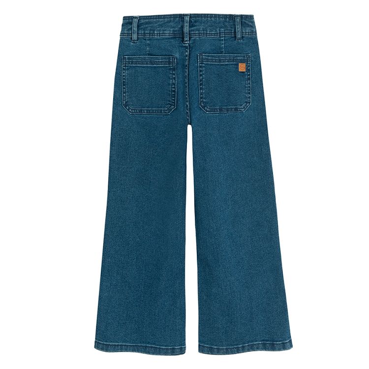 Blue denim trousers with square pockets in the front