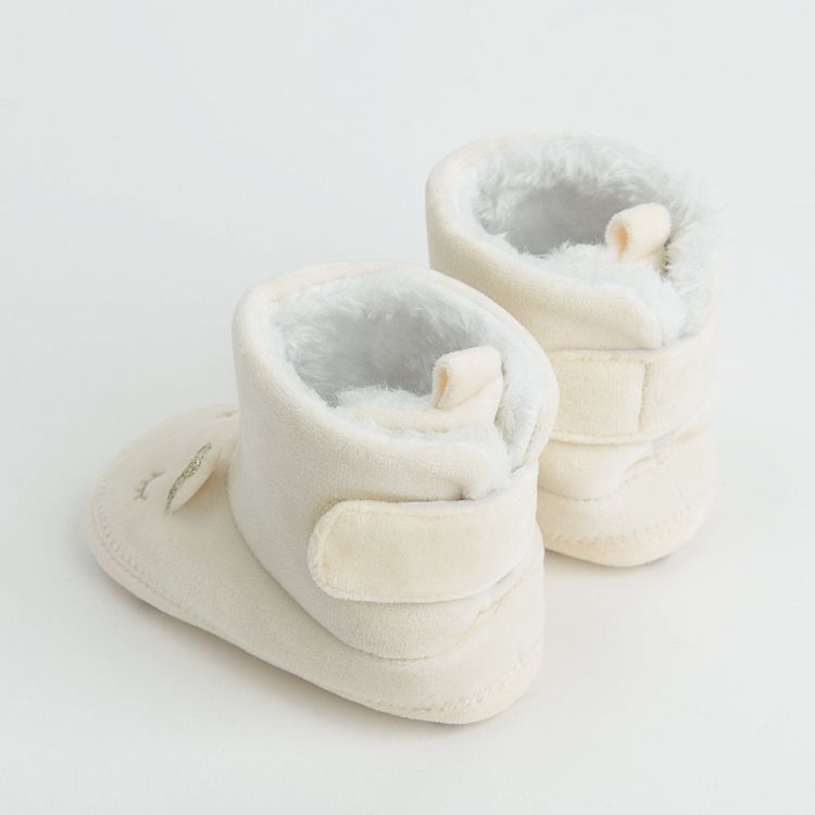 White newborn slippers with gold unicorn print