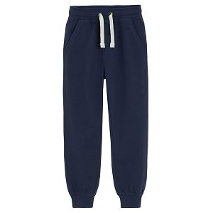Dark blue sweatpants with elastic ankles and cord