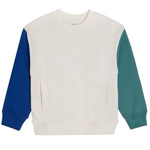 White sweatshirt with a blue and green sleeve