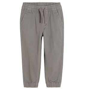 Grey trousers with adjustable waist