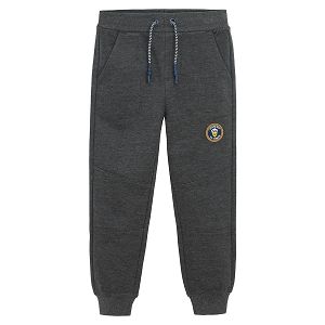 Grey jogging pants with cord on the waist