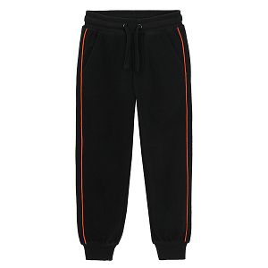 Black jogging pants with orange side stripe