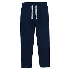 Blue jogging pants with cord on the waist