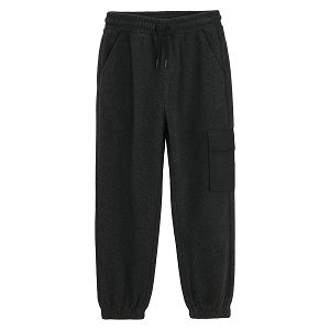 Grey jogging pants with pocket on the left leg