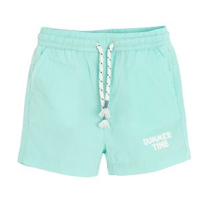 Light turquoise shorts with cord on the waist