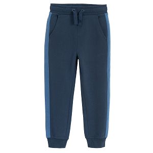 Blue sweatpants with stripe on the side and cord