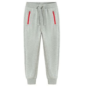 Grey jogging pants with corded waist and elastic around the ankles